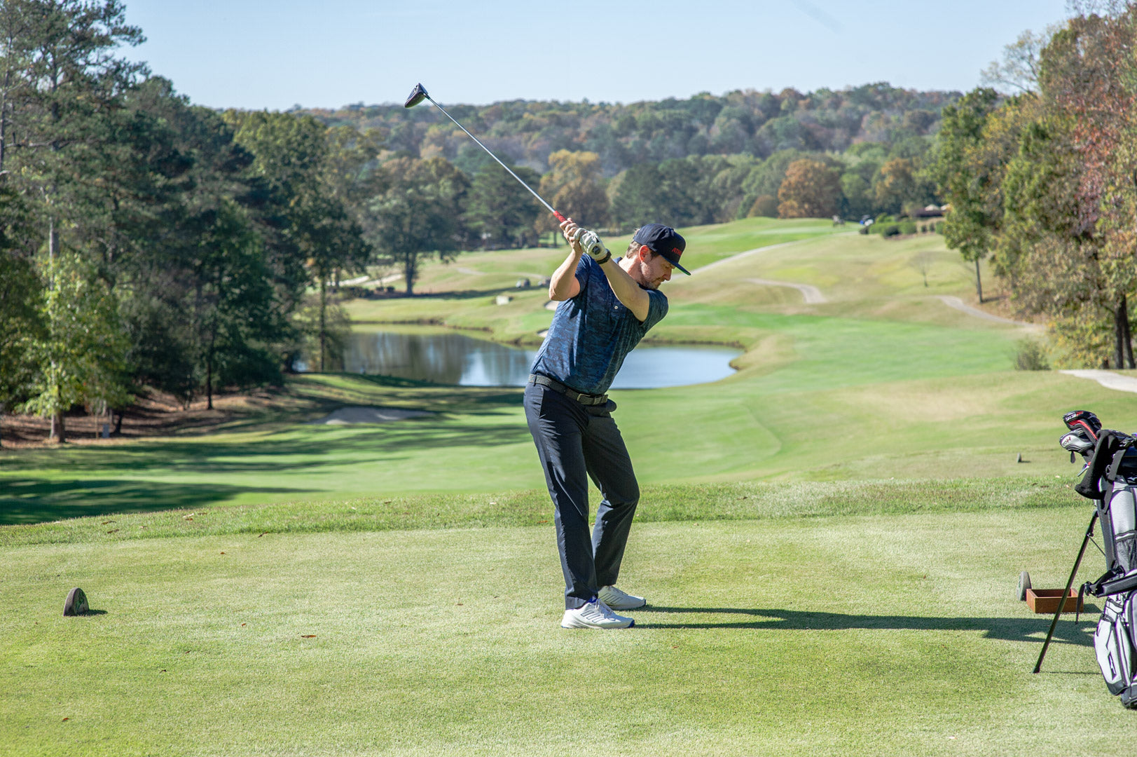 Golfer teeing off