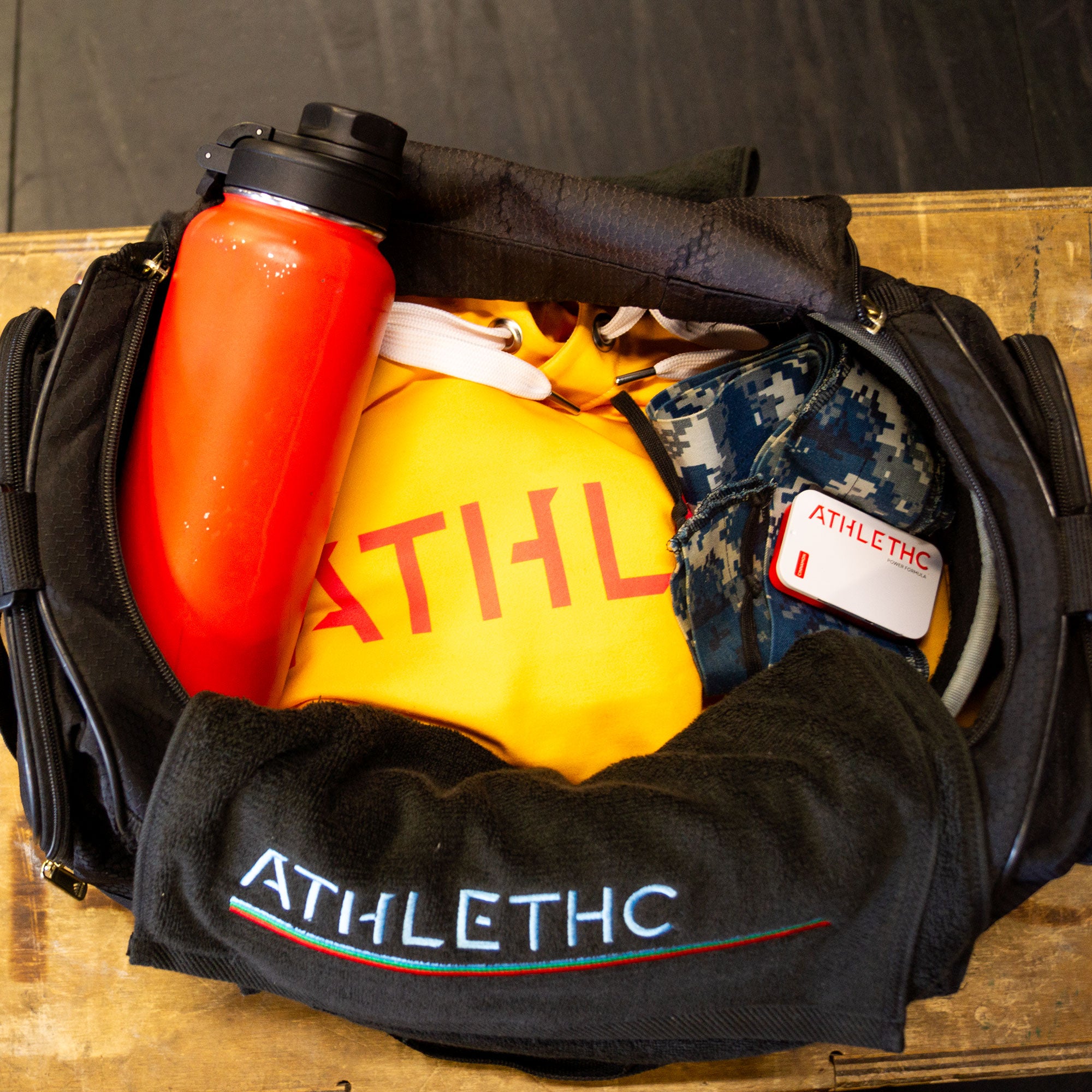 Gym bag filled with ALTHETHC gear.