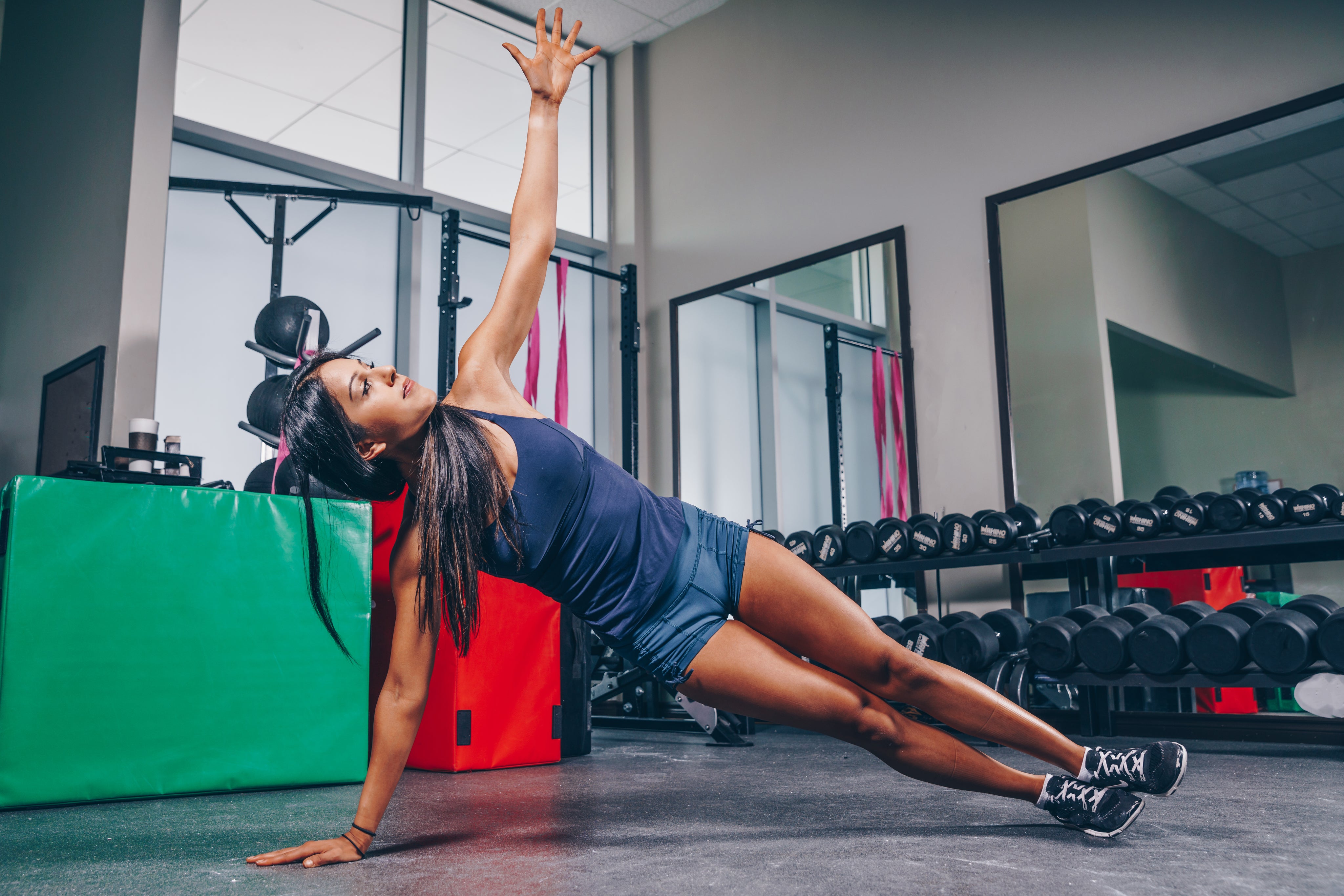 Woman stretching in a gym