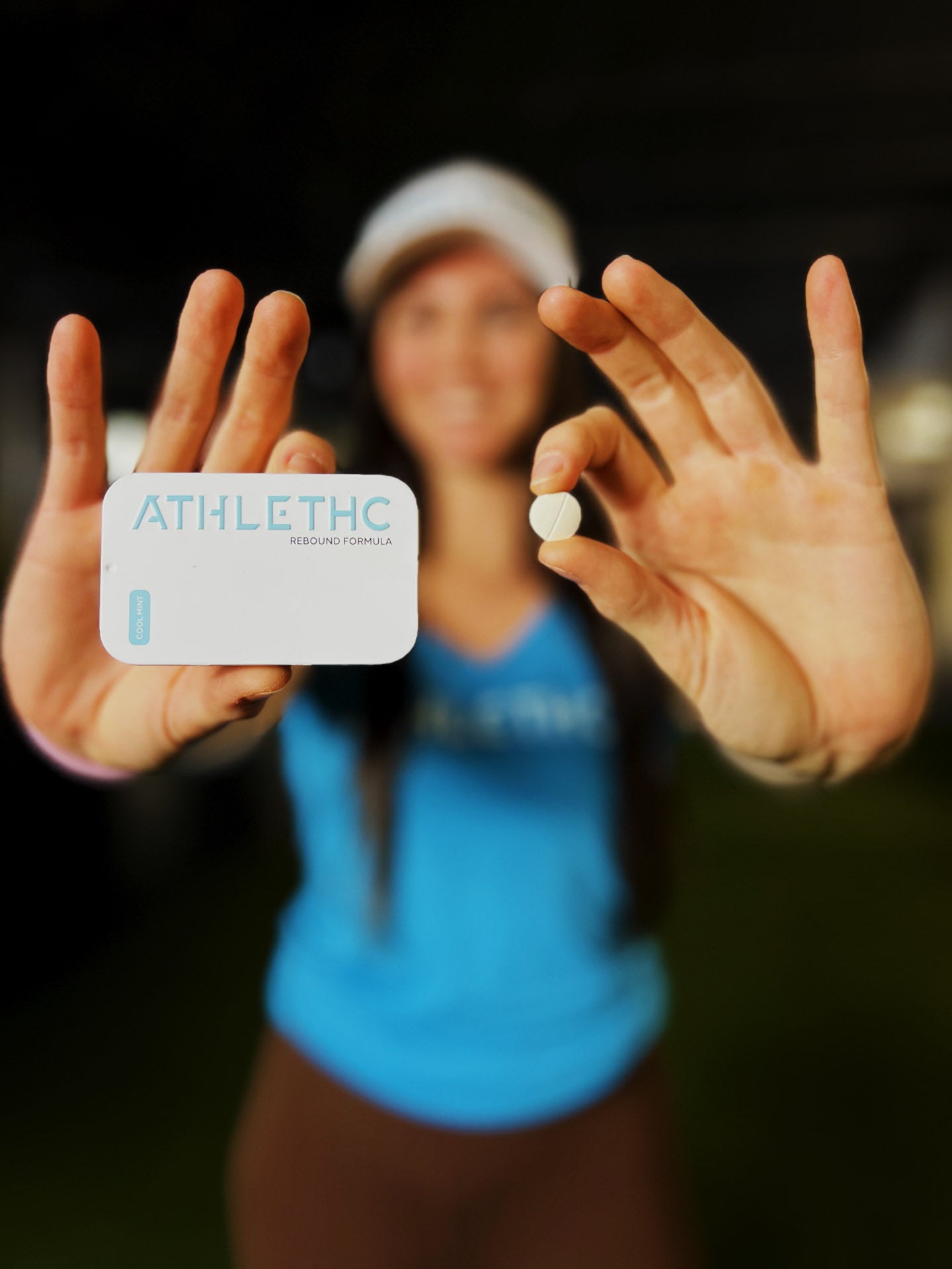 Woman holding a tin of mints