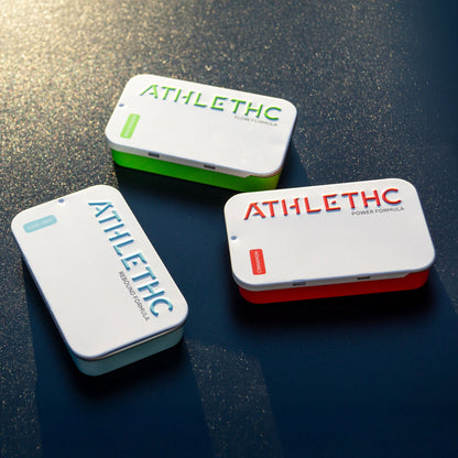 Three 'ATHLETHC' containers on a reflective surface