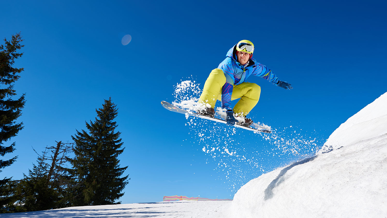 Man snowboarding off a jump.