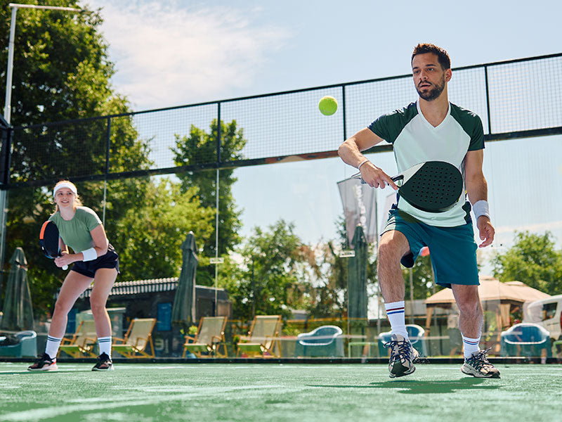 Couple playing pickleball